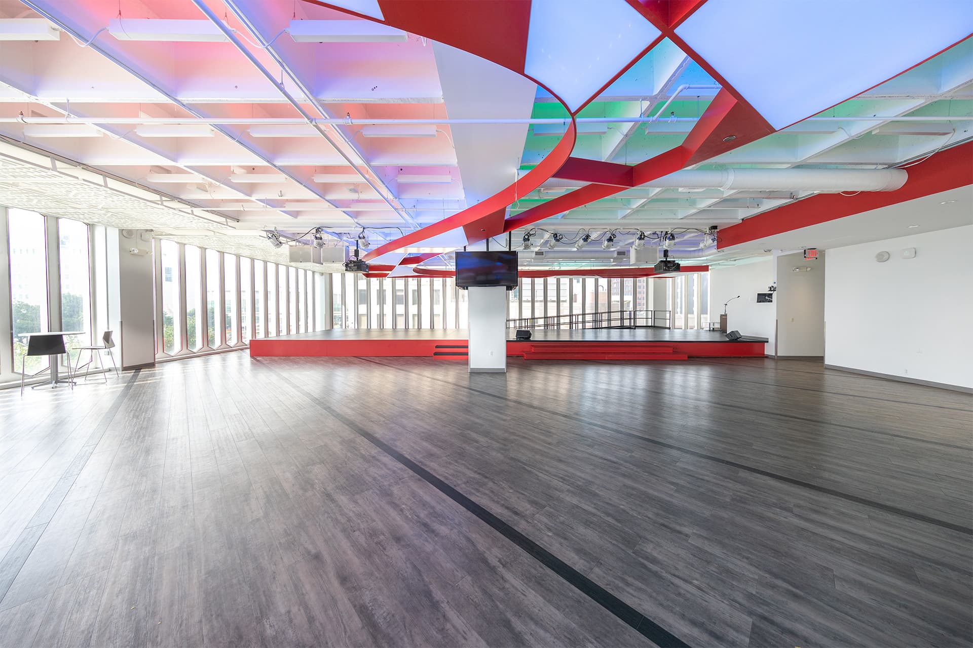 Stage in the event room on the 2nd floor of The Beacon at The One Woodward building, set without furniture.
